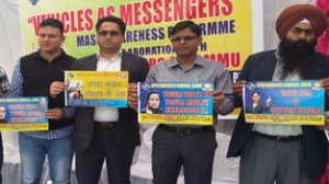 Dignitaries launching ‘Vehicles as Messengers Campaign’ under SVEEP at Jammu on Saturday.