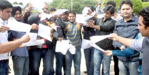 Scholars and students burning the order copies during protest at Jammu University on Friday.