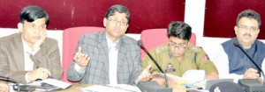 Returning Officer Ajeet Kumar Sahu chairing a meeting at Jammu on Thursday.