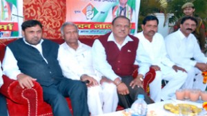 Ex-minister Mula Ram, MP Madan Lal, M L Kashyap  and others  at an election meeting in Jammu on Sunday. 