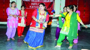 Students presenting cultural item at Bharat College of Education in Kathua.