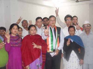 Congress workers showing the victory signs during a meeting on Thursday.