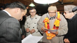 National Conference candidate, Dr. Farooq Abdullah accompanied by Chief Minister Omar Abdullah and Prof Saif-ud-Din Soz filing his nomination papers for Srinagar Lok Sabha constituency on Monday.—Excelsior/Amin War