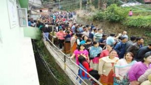 People stand in queue to cast their vote for Lok Sabha polls at a polling station during the 4th phase of Lok Sabha polls at Gangtok in Sikkim on Saturday. (UNI)