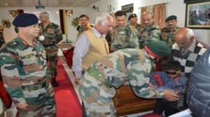 Lt Gen HJS Sachdev shaking hand with a minor patient treated during surgical eye camp at Udhampur.