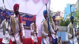 Artists performing cultural item during Baisakhi Mela at Udhampur on Wednesday.