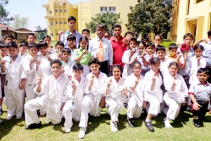 Karatekas of GD Goneka Public School posing for a photograph after clinching medals.