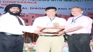 GMC Biochemistry HoD Dr AS Bhatia being honoured at the conference.