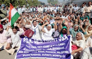 DPs from PoK staging protest dharna near Press Club in Jammu on Thursday.         -Excelsior/ Rakesh