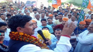 Jugal Kishore Sharma addressing election rally at Nowshera on Saturday.