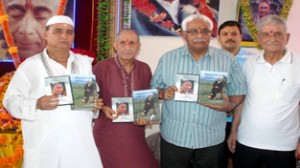 Vijay Bakaya and Swami Kumar Ji releasing CD & Shiv Sutra at Ishwar Ashram, Mohinder Nagar on Saturday.