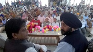 Cong leaders Manul Haq and Manjit Singh during an election meeting in Ramgarh on Monday.