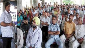 Chief spokesperson PCC and MLC, Ravinder Sharma addressing a large gathering at Sunderbani on Monday. 