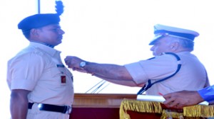 DG CRPF Dalip Trivedi awarding Constable Naresh Kumar during CRPF Day.