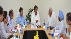 Minister for Housing Raman Bhalla chairing a meeting of SKUAST-J scientists on Monday.
