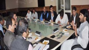 Minister for Tourism GA Mir chairing a meeting at Srinagar on Monday.