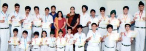 Medal winners in kickboxing championship displaying certificates during felicitation function at DPS Jammu.