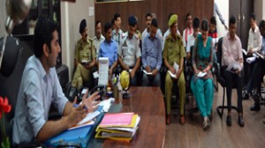 Deputy Commissioner Dr Shahid Iqbal chairing a meeting at Reasi on Monday.