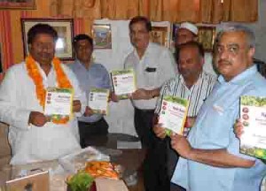Minister for Housing, Raman Bhalla and others releasing the books on Thursday.