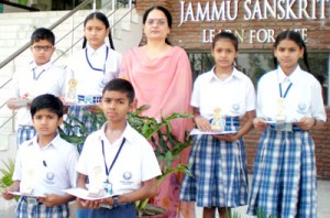 Winners of story telling competition posing for a photograph at Jammu Sanskriti School.