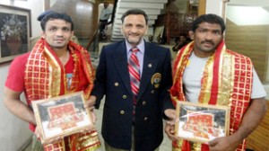 Ace International Wrestlers Yogeshwar Datt and Ravinder Singh being honoured by President, Indian Style Wrestling Association, Shiv Kumar Sharma on Sunday.
