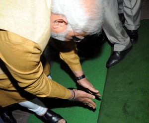 Prime Minister designate Narendra Modi bows down in respect at the steps of the Parliament House upon his arrival to attend the BJP Parliamentary Party meeting in New Delhi on Tuesday. (UNI)