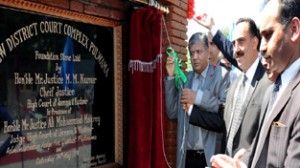 Chief Justice of State High Court, Justice M M Kumar laying foundation stone of new District Court Complex at Pulwama on Saturday. -Excelsior/Younis Khaliq