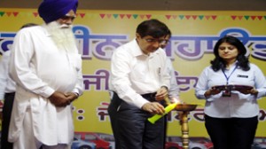 Maruti Suzuki COO Mayank Pareek lighting ceremonial lamp at inaugural of Gramin Mahotsav at Taran Taran on Tuesday.