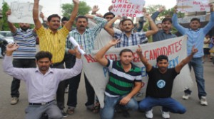 Jail Warden candidates shouting anti-Government slogans during a protest at Jammu.