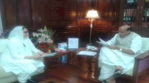 SDP leader Dr Darakhshan Andrabi presenting vision document of her party to Union Home Minister Rajnath Singh in Delhi on Friday.