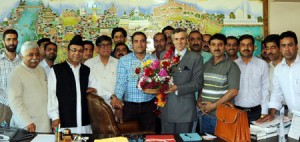 Chief Minister Omar Abdullah and his Cabinet colleagues with employees’ representatives in Srinagar on Tuesday.