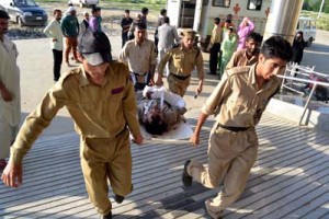 Cops shift an accident victim to hospital in Uri on Friday. —Excelsior/Aabid Nabi