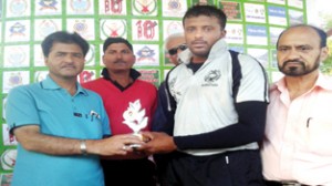 Man of the match award being presented to the winner by Syed Riaz, Director City Channel.