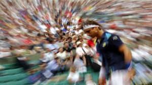 David Ferrer of Spain walks on the court after a break in play in his men's singles match against Kevin Anderson of South Africa at the French Open tennis tournament at the Roland Garros stadium in Paris. (UNI)