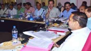 Minister for PHE, Sham Lal Sharma chairing a meeting at Jammu on Saturday.