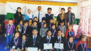 Winners posing alongwith dignitaries during Rhymes Recitation Competition at DPS in Leh.
