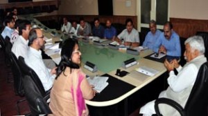 Minister for Planning, Ajay Sadhotra chairing a meeting at Srinagar on Tuesday.