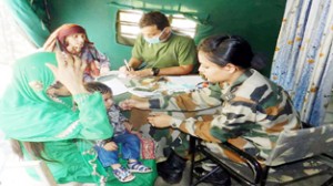 Patients being observed by Army doctors during a medical camp at Chitti Bakri.