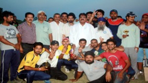 Jubilant winners of Sakshi Squalia Memorial Cricket Tournament posing alongwith guests at Domana in Jammu.