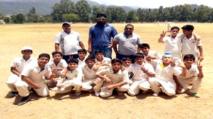 Winners Jammu District team posing for a group photograph alongwith officials in Udhampur on Saturday.  