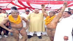 Provincial President NC, Devender Singh Rana declaring winner during wresting competition.