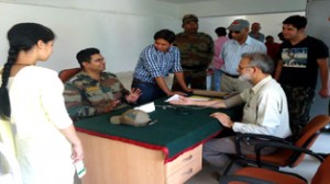 Army doctors examining Rector Bhaderwah campus G M Bhat during a medical camp on Sunday.