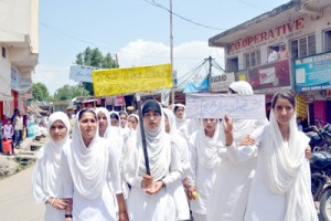 Students holding placards during Anti Tobacco and Traffic Awareness Programme in Poonch.   