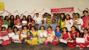 Students of KC Gurukul College of Education posing for a photograph alongwith staff members during Annual Day celebration.