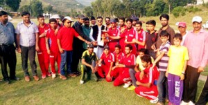 Jubilant players of Mendhar Super Stars posing for a group photograph alongwith the dignitaries.