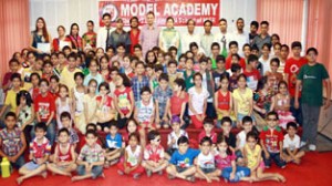 The students posing for group photograph during the summer camp on Saturday.