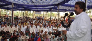 Minister for Sports, Raman Bhalla addressing a large gathering after laying foundation stone of Play Field at Bandu Rakh.