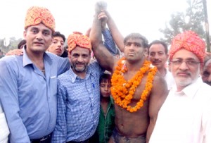 Wrestler being felicitated by the dignitaries at Jagti in Jammu.