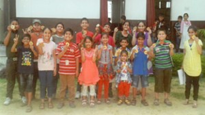 Students of Minerva School of Learning posing for a group photograph after receiving medals.