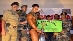 Body Builder being felicitated during Mr Baramulla 2014 event.